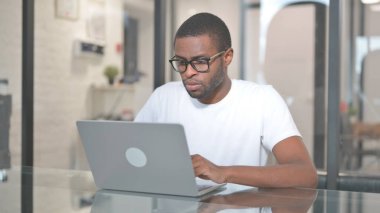 African American Man Working on Laptop