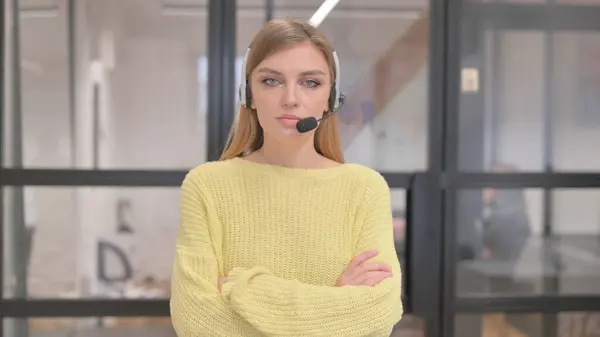 Portrait of Serious Blonde Woman with Headset in Call Center