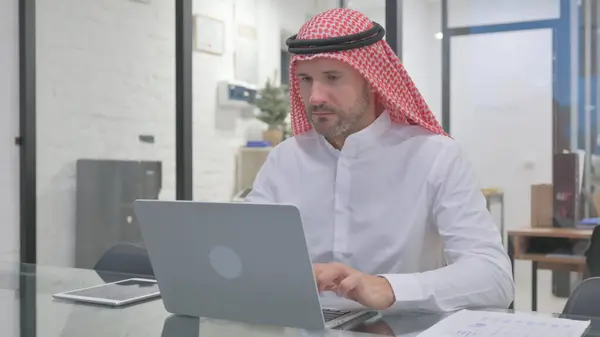 stock image Middle Aged Muslim Man Typing on Laptop