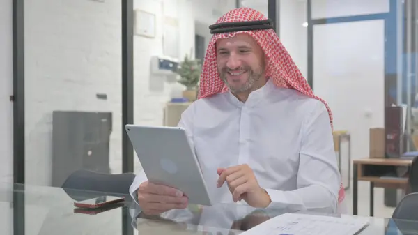 stock image Middle Aged Muslim Man Doing Video Chat on Tablet in Office