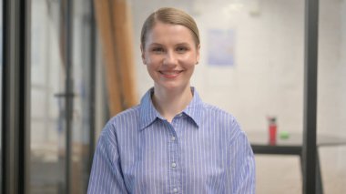 Portrait of Smiling Creative Young Woman