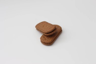 a close up of chocolate biscuit isolated on white background.