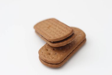 a close up of chocolate biscuit isolated on white background.