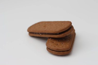 a close up of chocolate biscuit isolated on white background.