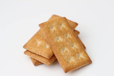 a close up of coconut biscuit with sprinkled sugar isolated on white background.