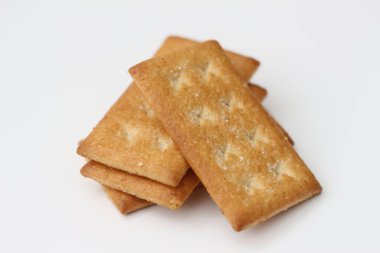 a close up of coconut biscuit with sprinkled sugar isolated on white background.