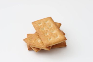 a close up of coconut biscuit with sprinkled sugar isolated on white background.