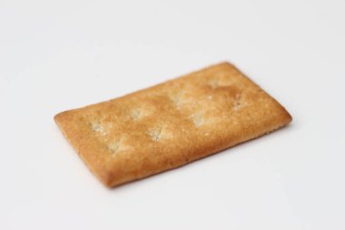 a close up of coconut biscuit with sprinkled sugar isolated on white background.