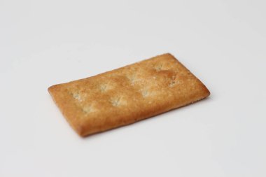 a close up of coconut biscuit with sprinkled sugar isolated on white background.
