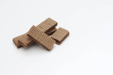 a close up of chocolate wafers isolated on white background.