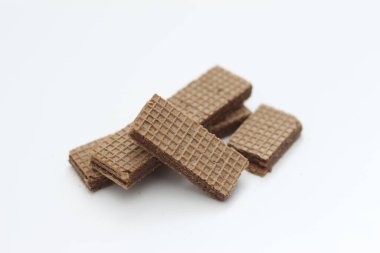 a close up of chocolate wafers isolated on white background.