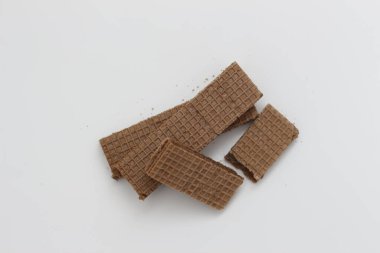 a close up of chocolate wafers isolated on white background.