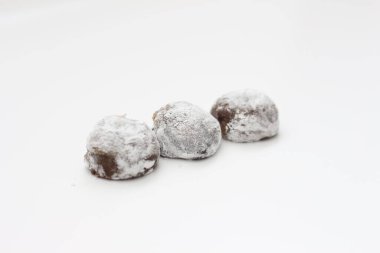 a close up of chocolate flavored mochi isolated on white background.