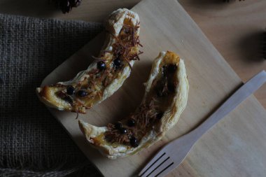 banana milk crispy. made from banana, milk, eggs, and flour with grated cheese and chocolate.