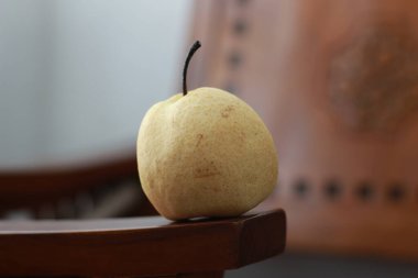 a close up of pear isolated natural pattern wood background. healthy food concept photo. water-rich fruit.