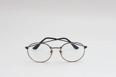 a close up of eyeglasses with black frames isolated on white background