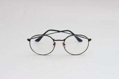 a close up of eyeglasses with black frames isolated on white background
