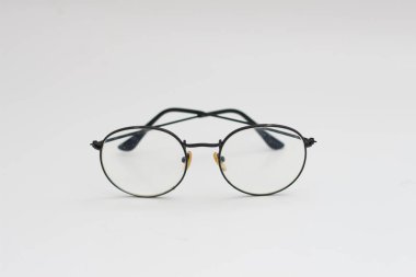 a close up of eyeglasses with black frames isolated on white background