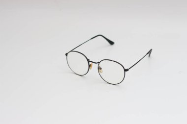 a close up of eyeglasses with black frames isolated on white background