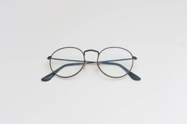 a close up of eyeglasses with black frames isolated on white background