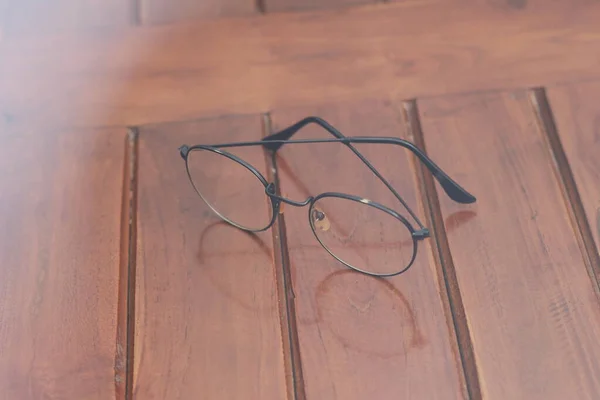 Close Eyeglasses Black Frames Isolated Natural Patterned Wooden Background — Φωτογραφία Αρχείου