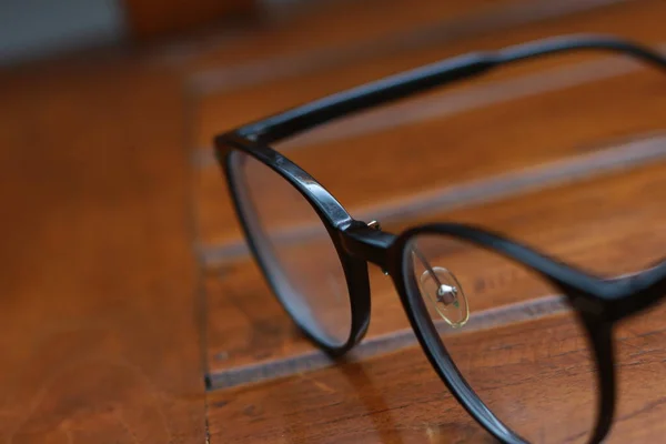 Close Eyeglasses Black Frames Isolated Natural Patterned Wooden Background — Stock fotografie