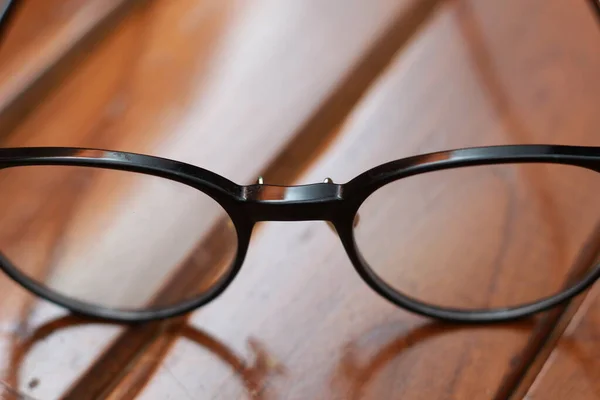 Close Eyeglasses Black Frames Isolated Natural Patterned Wooden Background — Fotografia de Stock