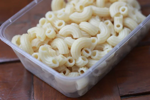 Close Boiled Macaroni Transparent Container Natural Patterned Wood Food Concept — Fotografia de Stock