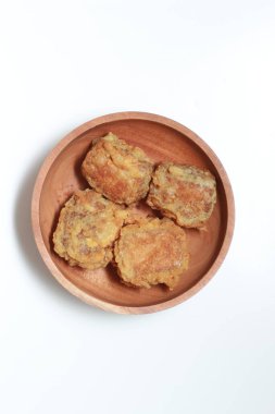 a close up of a bowl of fried stuffed tofu isolated on white background. Indonesian food concept.