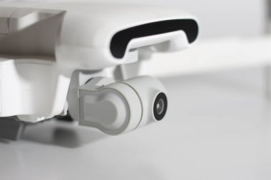 a close up of detailed white drone parts isolated on white background. drone camera photo concept.