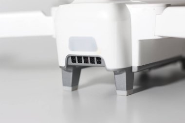 a close up of detailed white drone parts isolated on white background. drone camera photo concept.