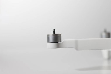 a close up of detailed white drone parts isolated on white background. drone camera photo concept.