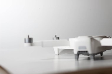 a close up of detailed white drone parts isolated on white background. drone camera photo concept.
