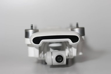 a close up of detailed white drone parts isolated on white background. drone camera photo concept.