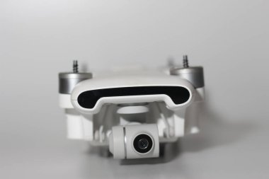 a close up of detailed white drone parts isolated on white background. drone camera photo concept.