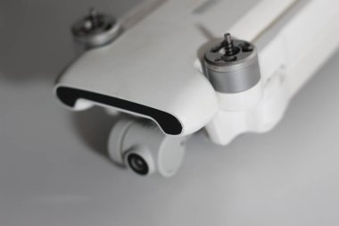 a close up of detailed white drone parts isolated on white background. drone camera photo concept.