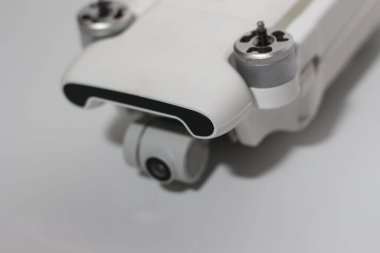 a close up of detailed white drone parts isolated on white background. drone camera photo concept.