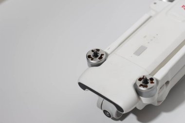 a close up of detailed white drone parts isolated on white background. drone camera photo concept.