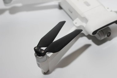 a close up of detailed white drone parts isolated on white background. drone camera photo concept.