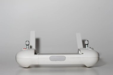 a close up of detailed white drone remote parts isolated on white background. drone camera photo concept.
