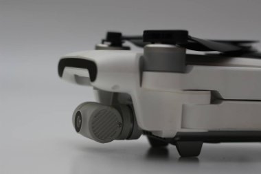 a close up of detailed white drone parts isolated on white background. drone camera photo concept.