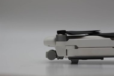 a close up of detailed white drone parts isolated on white background. drone camera photo concept.