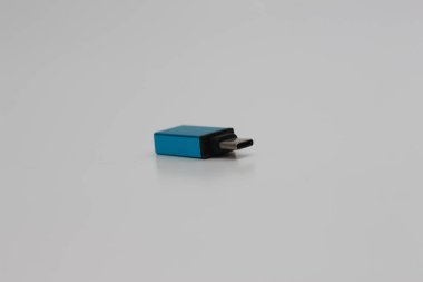 A close up of USB OTG (On The Go) Type C to Type A adapters with blue color isolated on a white background. technology product photo concept.