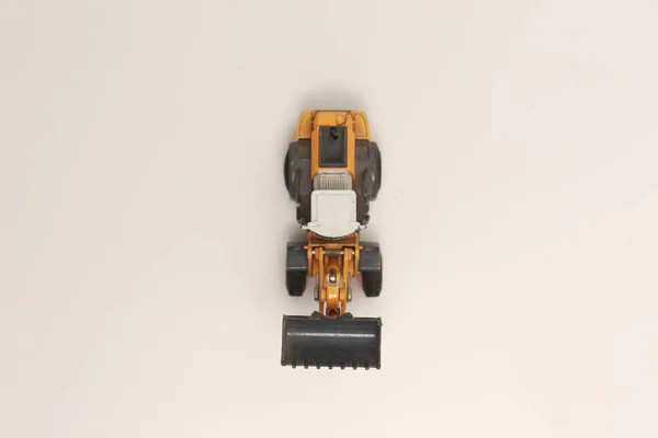 Close Miniature Orange Wheel Loader Toy Isolated White Background Concept — Stock Photo, Image