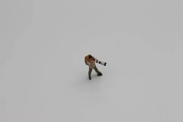 Close Miniature Figure Photographer Camera Telephoto Lens Isolated White Background — Photo