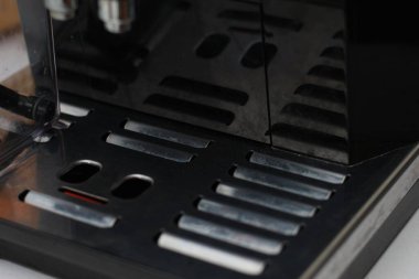 Detailed photo of black and metallic coffee brewer. coffee equipment concept photo.