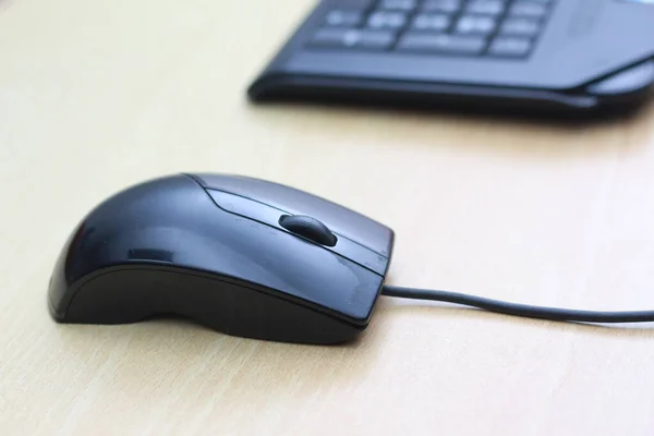 a photo of a black mouse and keyboard to work with. Technology equipment concept photo.