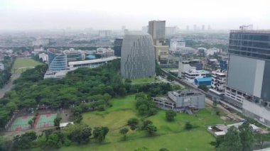 Tangerang, Indonesia - Nov 14 2022. 4K footage aerial view of shophouses and roads in BSD Tangerang, Indonesia.