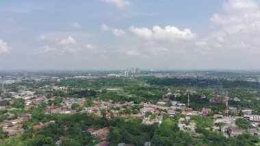 4K footage aerial view of residential area filled with greenery.
