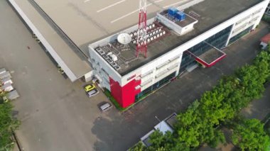 Bogor, Indonesia - October 19 2022. aerial view of office building and warehouse distribution center of retail based company at daytime.